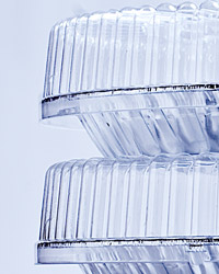 A stack of two rigid plastic containers