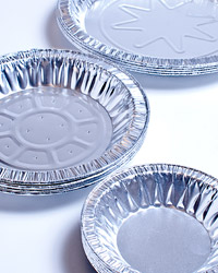 Three stacks of foil containers of various sizes